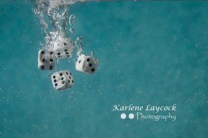 White Dice Falling into Water 3
