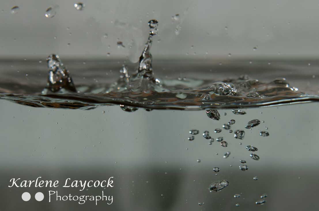High Speed Photography – Splashes of Water against a Grey background