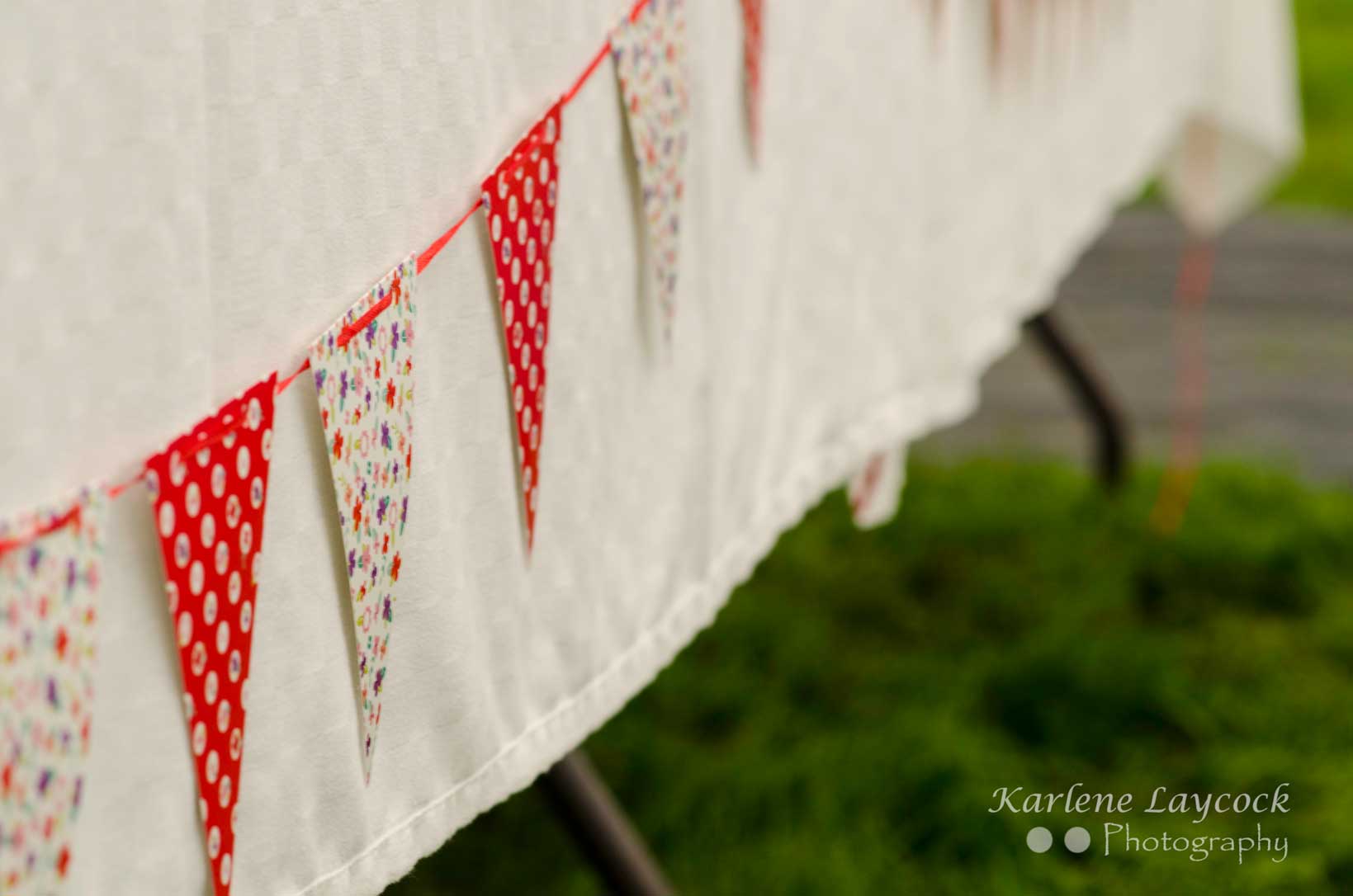 Red & Multicoloured Bake Off Bunting on a White Table Cloth